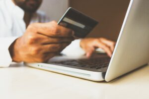 Making an online payment using laptop and credit card