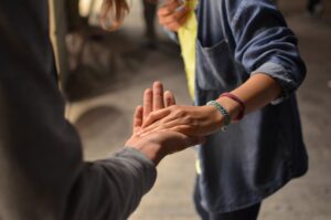 Man and woman holding hands